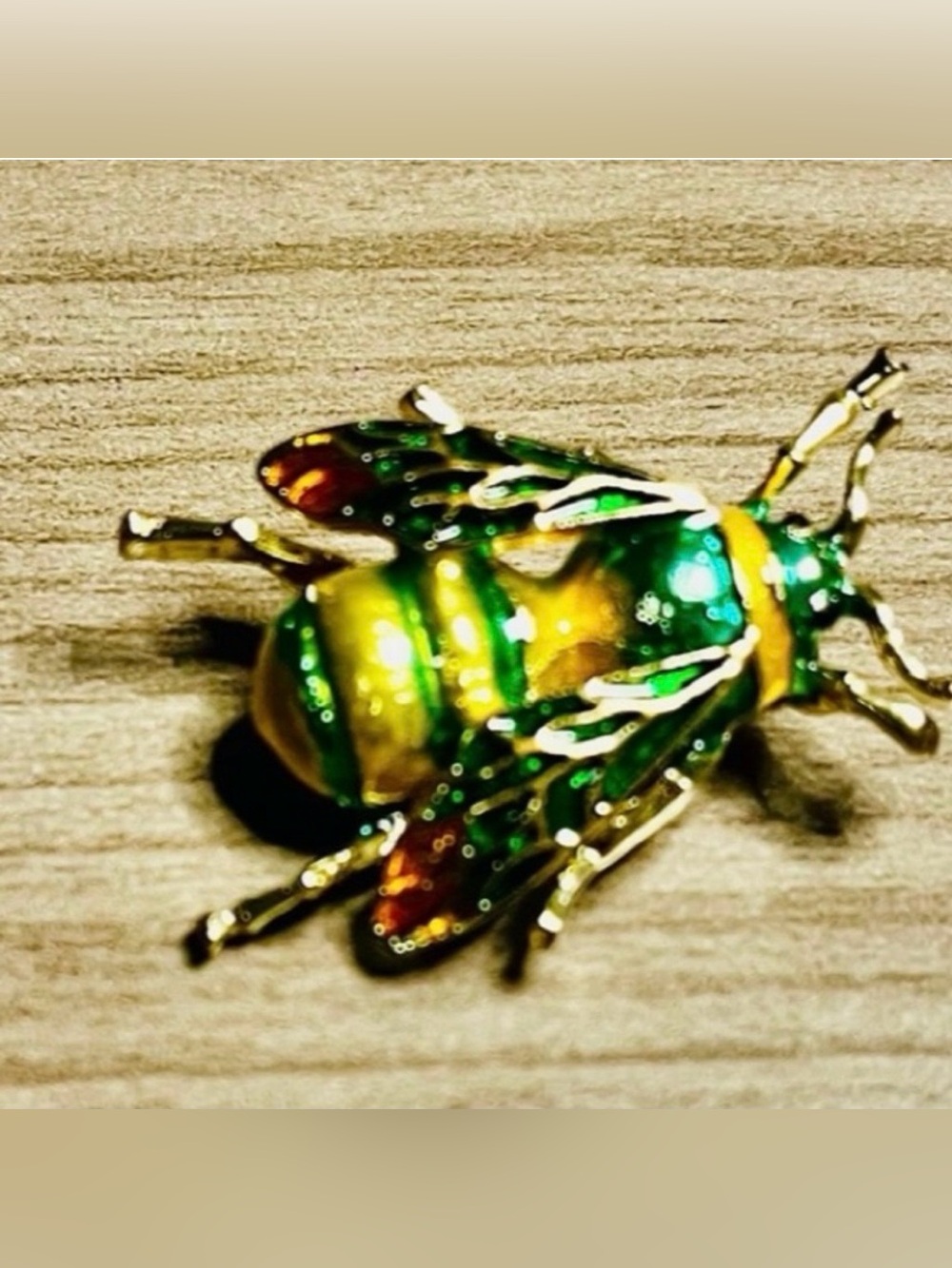 Green and gold insect brooch